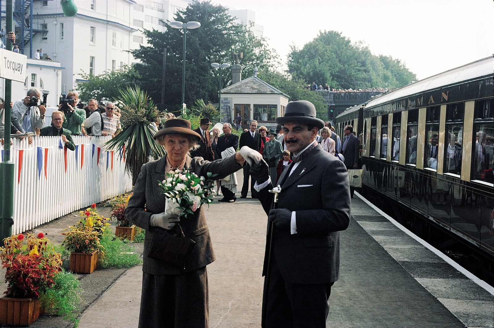 A picture of Joan Hickson and David Suchet as Agatha Christie's  Miss Marple and Hercule Poirot at Torquay station